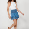 Short skirt with wide elastic waist and finished with floral embroidery for women | Current Fashion