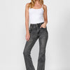 Long flared push-up denim pants with five pockets and front zipper and button closure with embroidered details for women