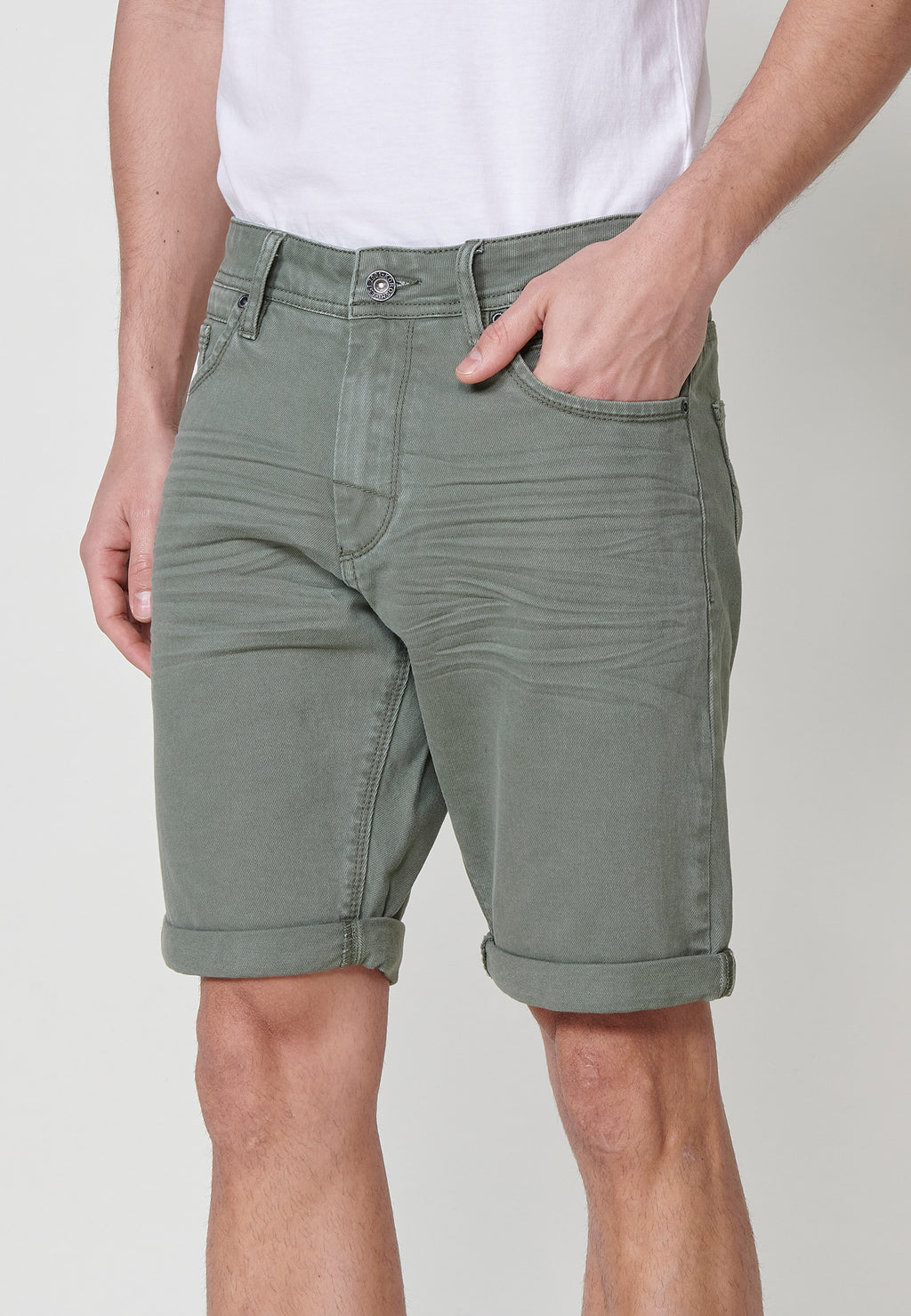 Regular fit Bermuda shorts with front zip and button closure, five pockets, one ticket pocket, and unfastened turn-up hems for men by .