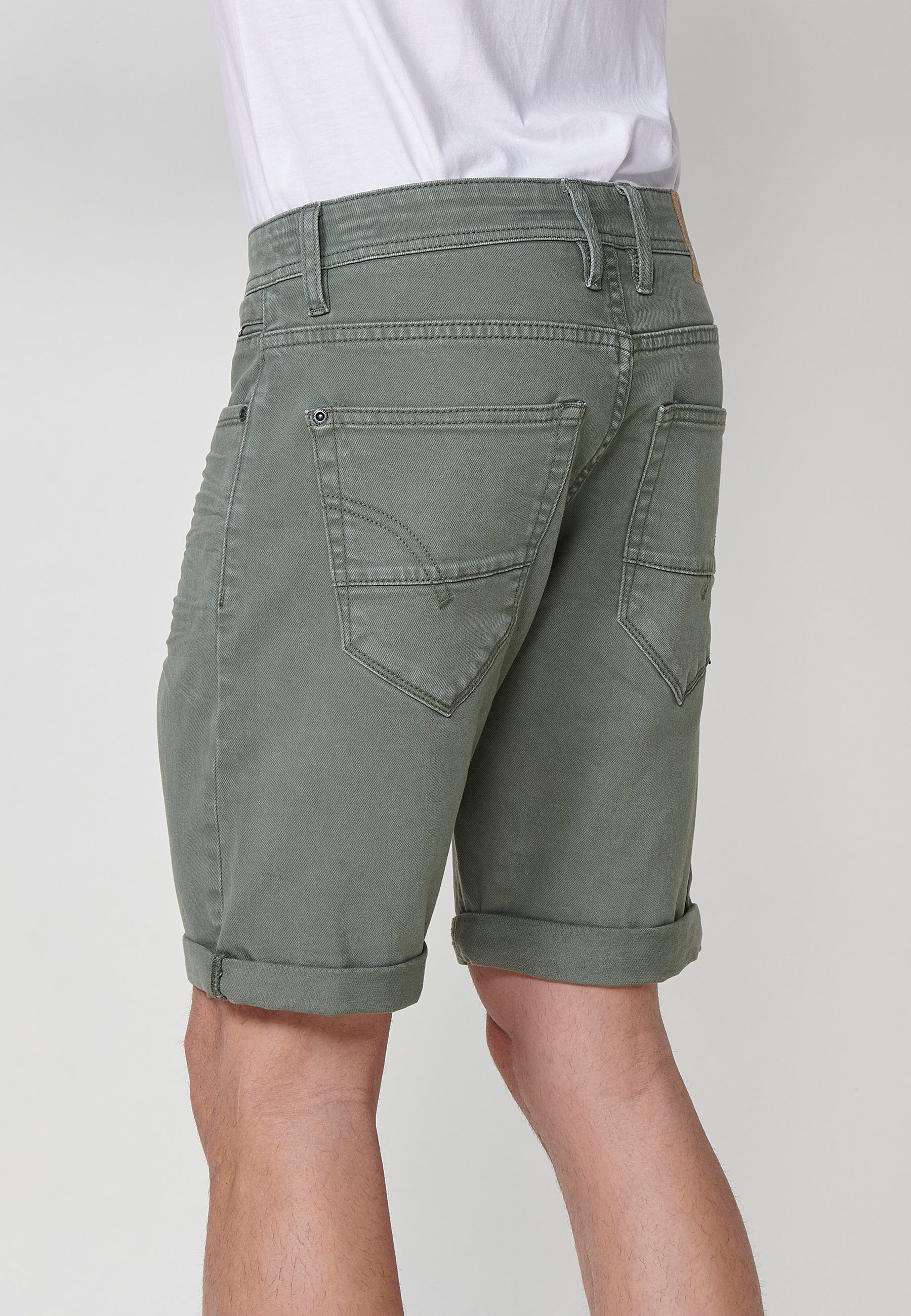 Regular fit Bermuda shorts with front zip and button closure, five pockets, one ticket pocket, and unfastened turn-up hems for men by .