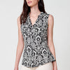 Sleeveless blouse with shirt collar and button closure with rounded hem and floral print with metal plate with Koröshi logo on the hem for women