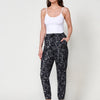 Satin Straight Pants High-Rise Jogger Model with Front Pockets Adjustable Elastic Waist with Low Bow with Gathered Rubber Butterfly Print Glitter Detail in the Pocket Piece with Stitching Details on the Knees Color Gray