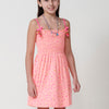 Girl's dress with fuchsia print, bow straps and gathered chest