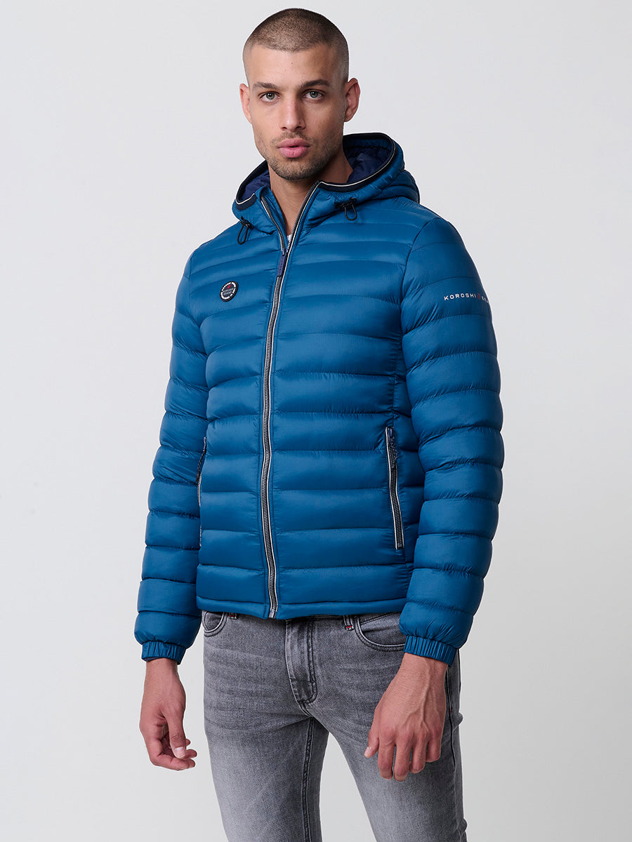 Chaqueta acolchada plumífero con capucha hombre azul vista lateral - Koroshi 2521JA49