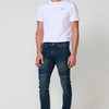 Jean Biker Skinny Fit pour homme en denim stretch bleu foncé. Coupe slim, détails biker et composition 98% coton, 2% élasthanne.