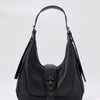 Leather effect women's shoulder bag, zipper closure and decorative metal buckle.