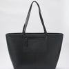 Leather effect women's shopper bag, zipper closure, interior pocket and removable toiletry bag.