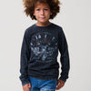 Camiseta de niño en algodón azul índigo con efecto desgastado, manga larga y estampado motero con bordados.