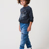 Boy's jogger pants in medium blue stretch denim washed effect fabric with cargo pockets. 100% cotton, comfortable and modern.