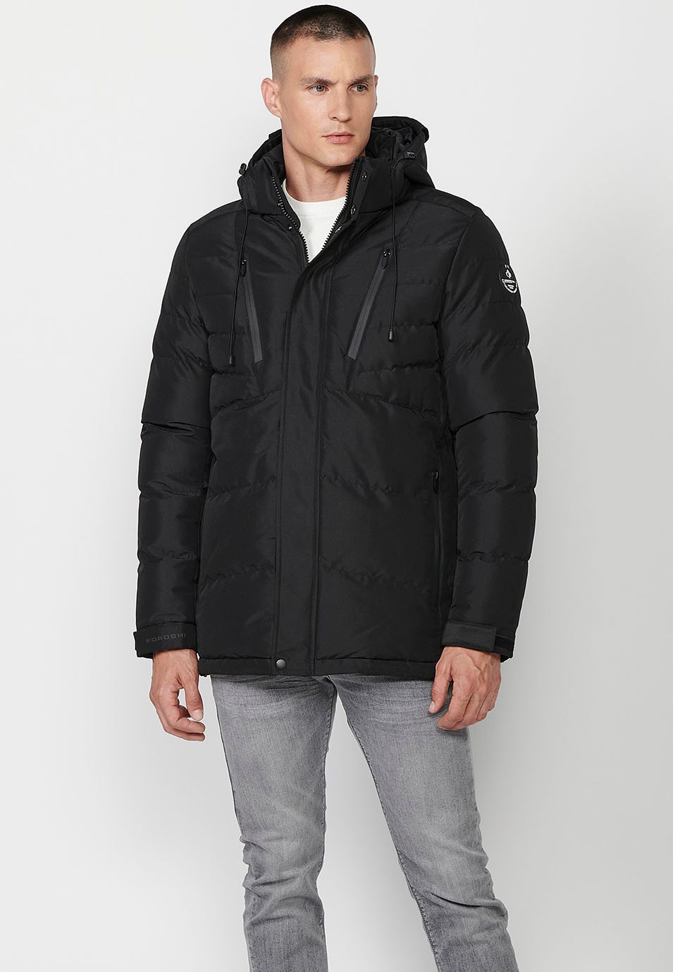 Veste matelassée avec col et capuche avec fermeture sur le devant et fermeture éclair pour homme en noir