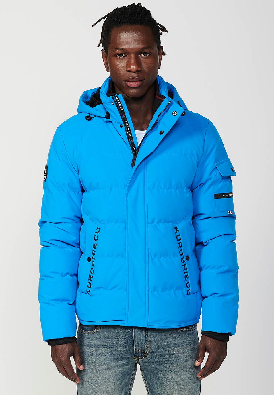 Veste matelassée bleue pour homme avec col et capuche avec fermeture frontale et fermeture éclair avec poches