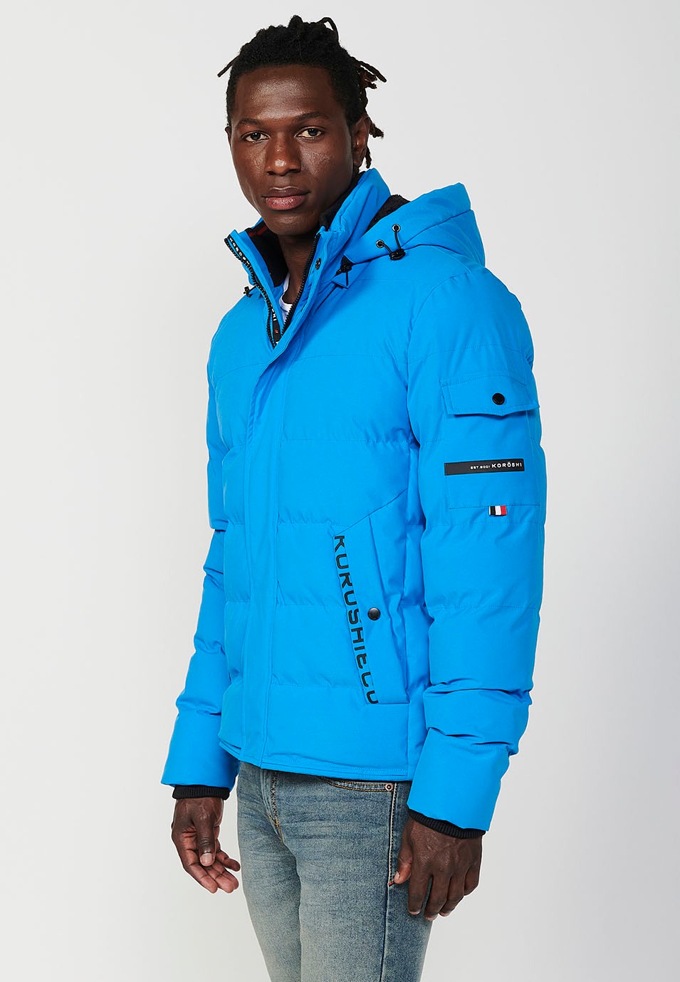 Veste matelassée bleue pour homme avec col et capuche avec fermeture frontale et fermeture éclair avec poches