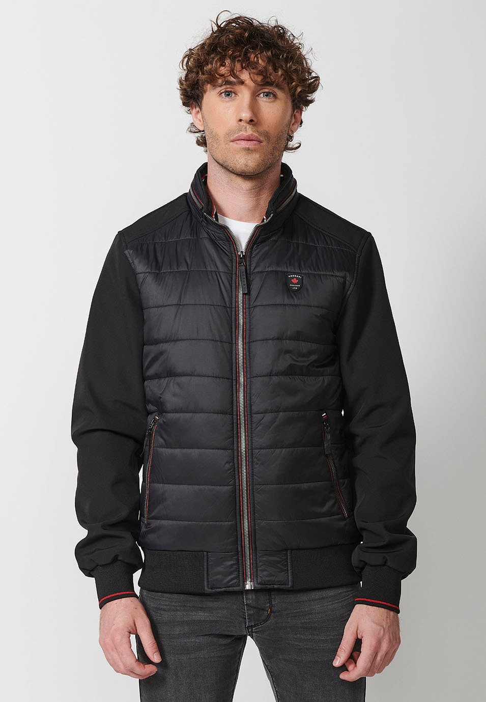 Chaqueta Cazadora acolchada de cuello alto con relleno con Cierre delantero con cremallera y Acabados en rib con Bolsillos con cremalleras color Negro para Hombre