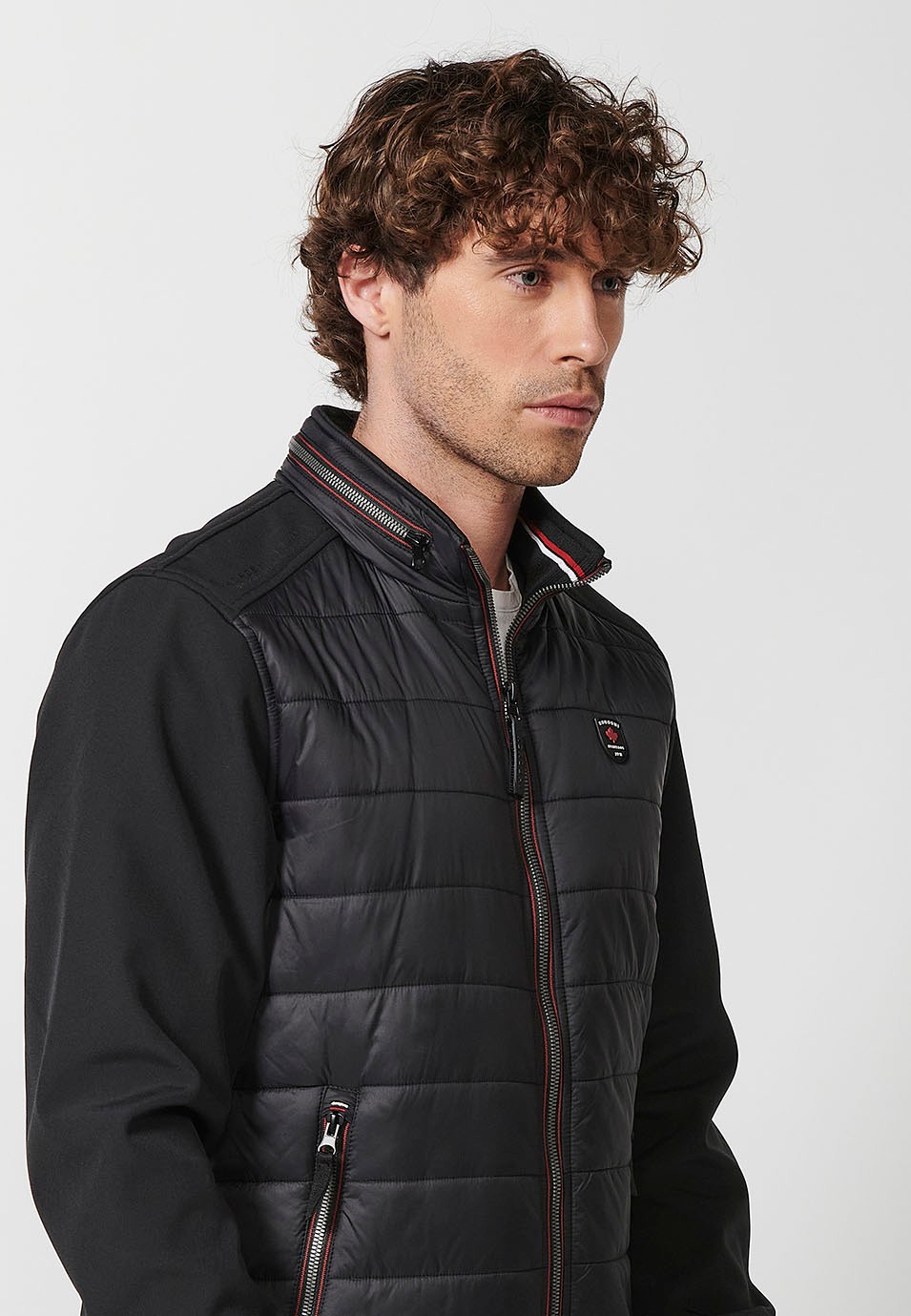 Chaqueta Cazadora acolchada de cuello alto con relleno con Cierre delantero con cremallera y Acabados en rib con Bolsillos con cremalleras color Negro para Hombre