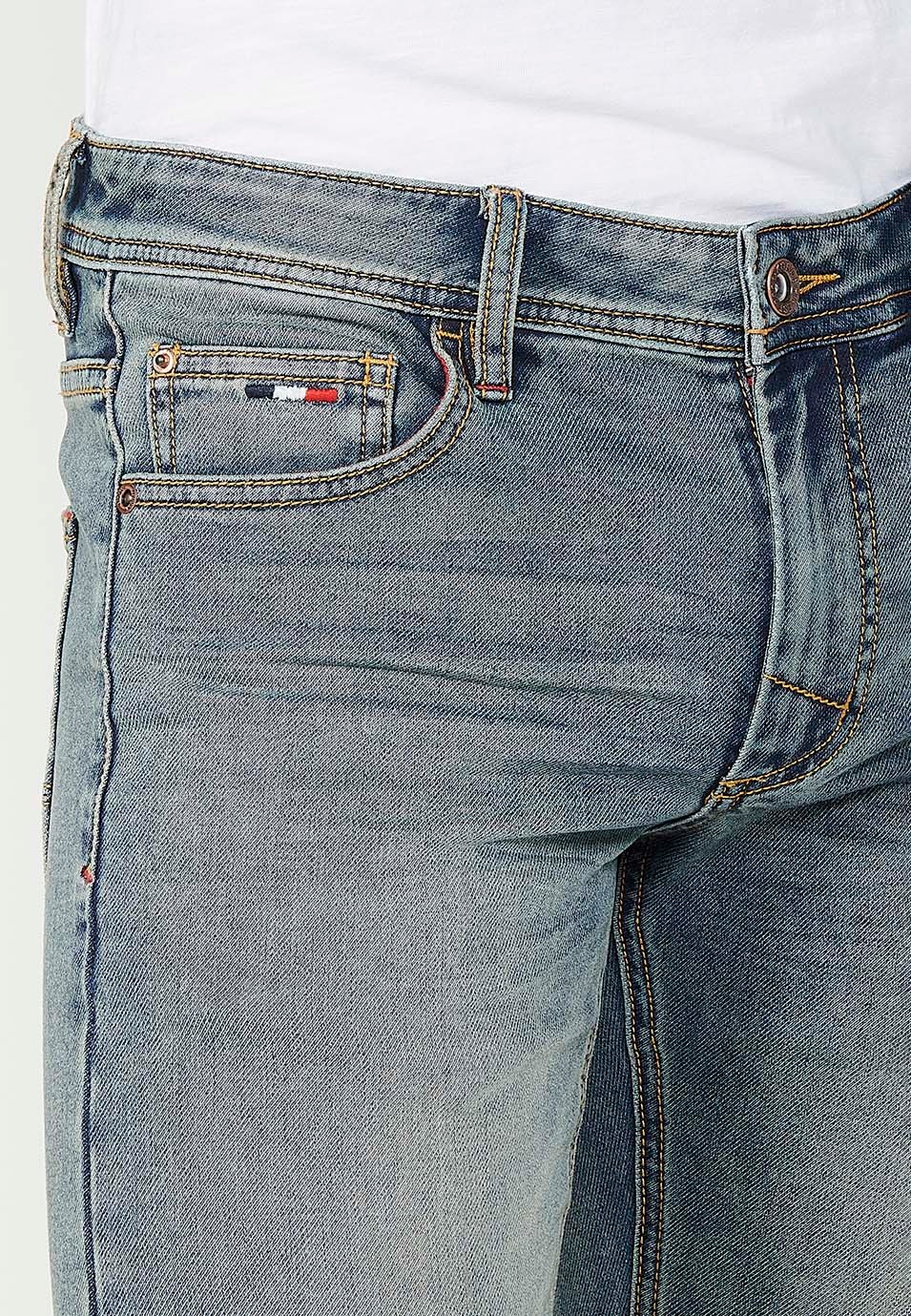 Pantalon long coupe slim avec cinq poches, une poche avec fermeture sur le devant avec fermeture éclair et bouton en Bleu pour Homme