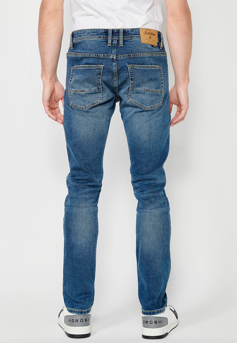 Pantalon long coupe slim avec fermeture éclair sur le devant et fermeture boutonnée en Bleu pour Homme