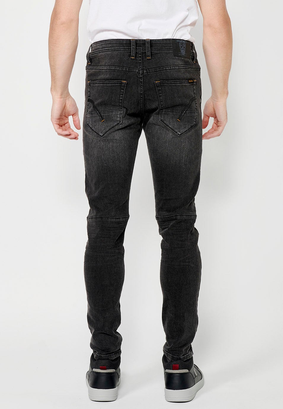 Pantalon long en denim style motard coupe skinny avec fermeture sur le devant avec fermeture éclair et bouton et détails sur les genoux en Noir pour Homme