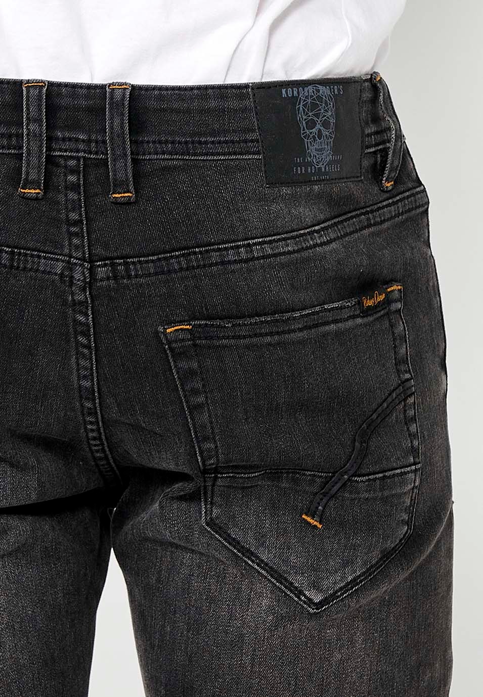 Pantalon long en denim style motard coupe skinny avec fermeture sur le devant avec fermeture éclair et bouton et détails sur les genoux en Noir pour Homme