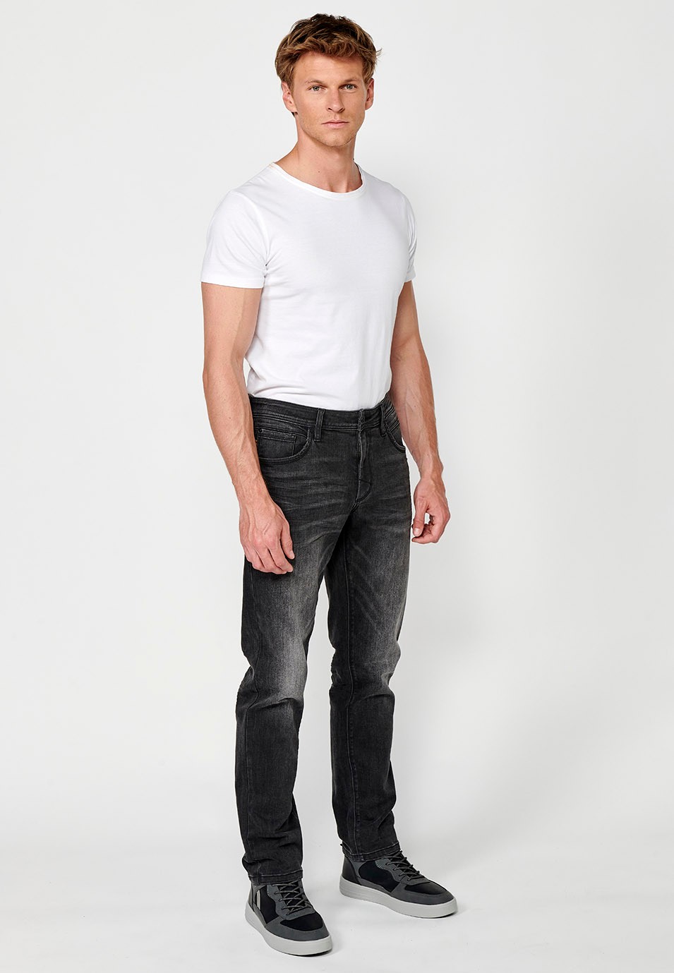 Straight regular fit denim long trousers with front zip and button closure and five pockets, one match pocket in black for men