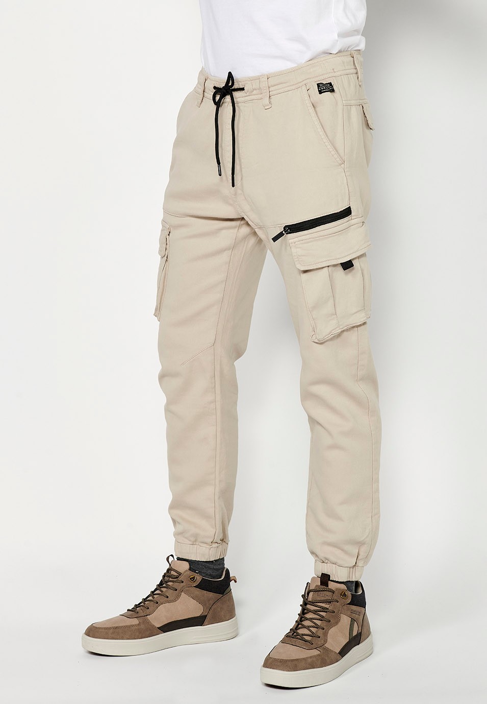 Men's beige jogger long pants with elastic waist and ankles and pockets 1