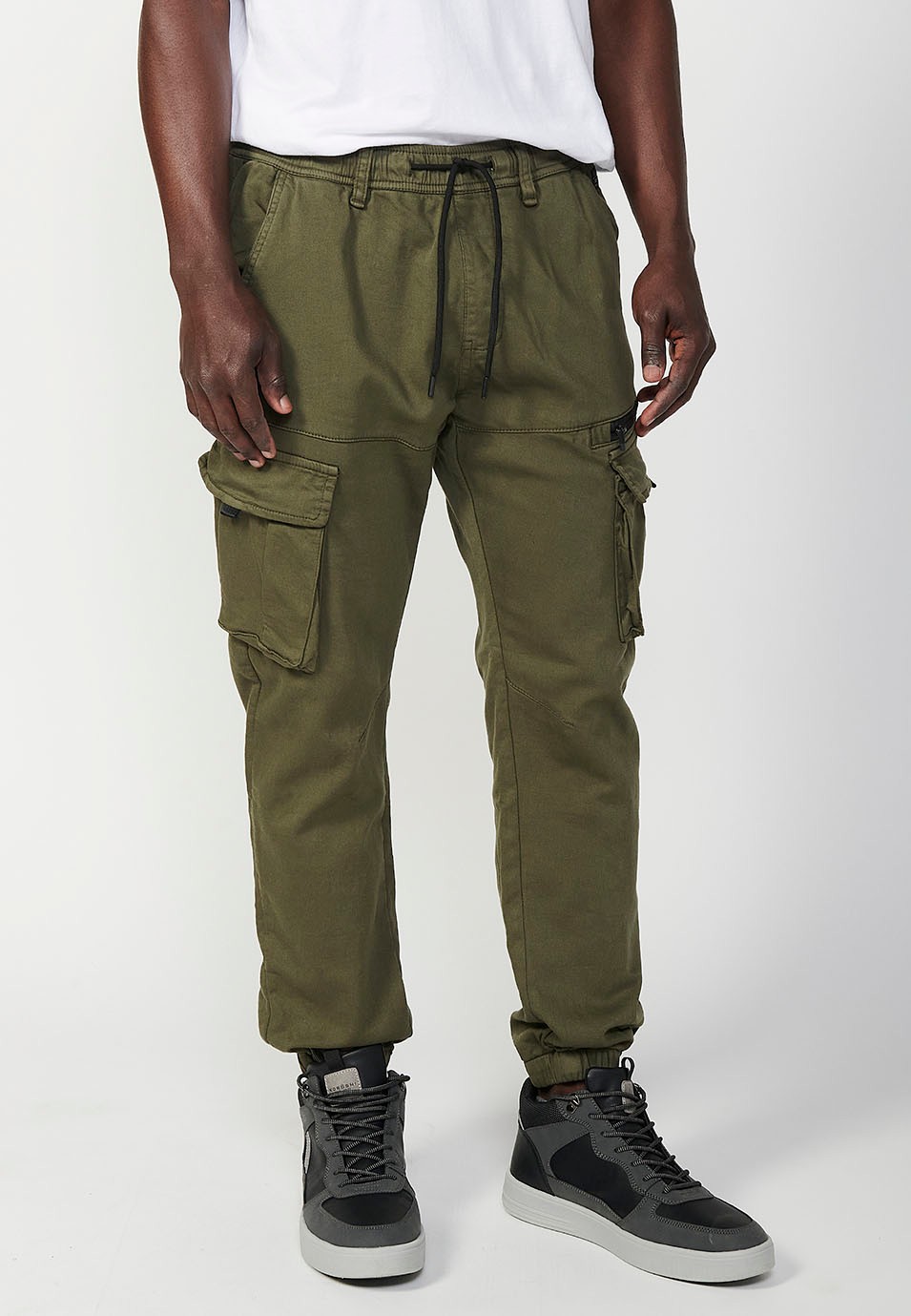 Long jogger pants with elastic waist and ankles and pockets for men in green 1