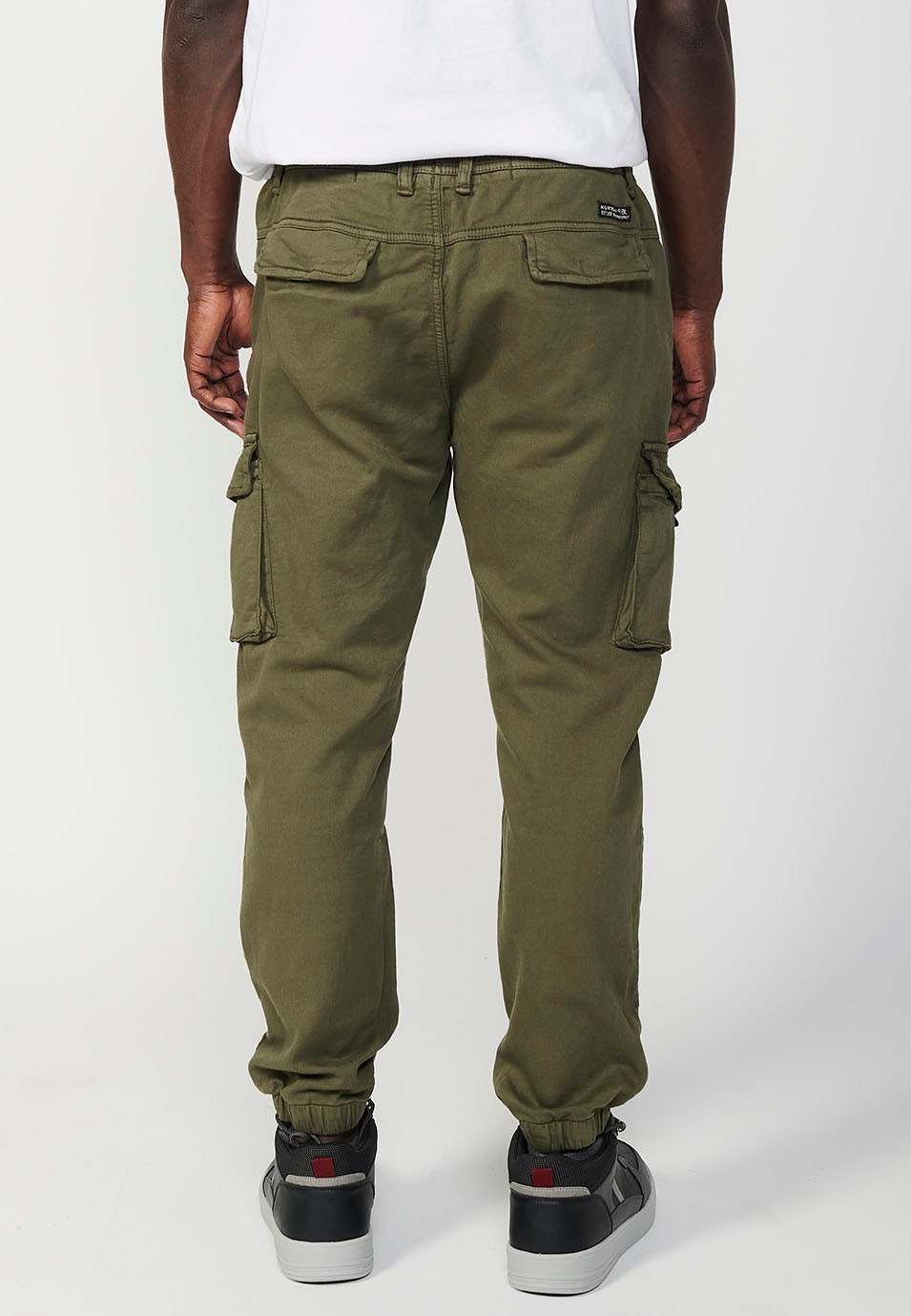 Long jogger pants with elastic waist and ankles and pockets for men in green 5