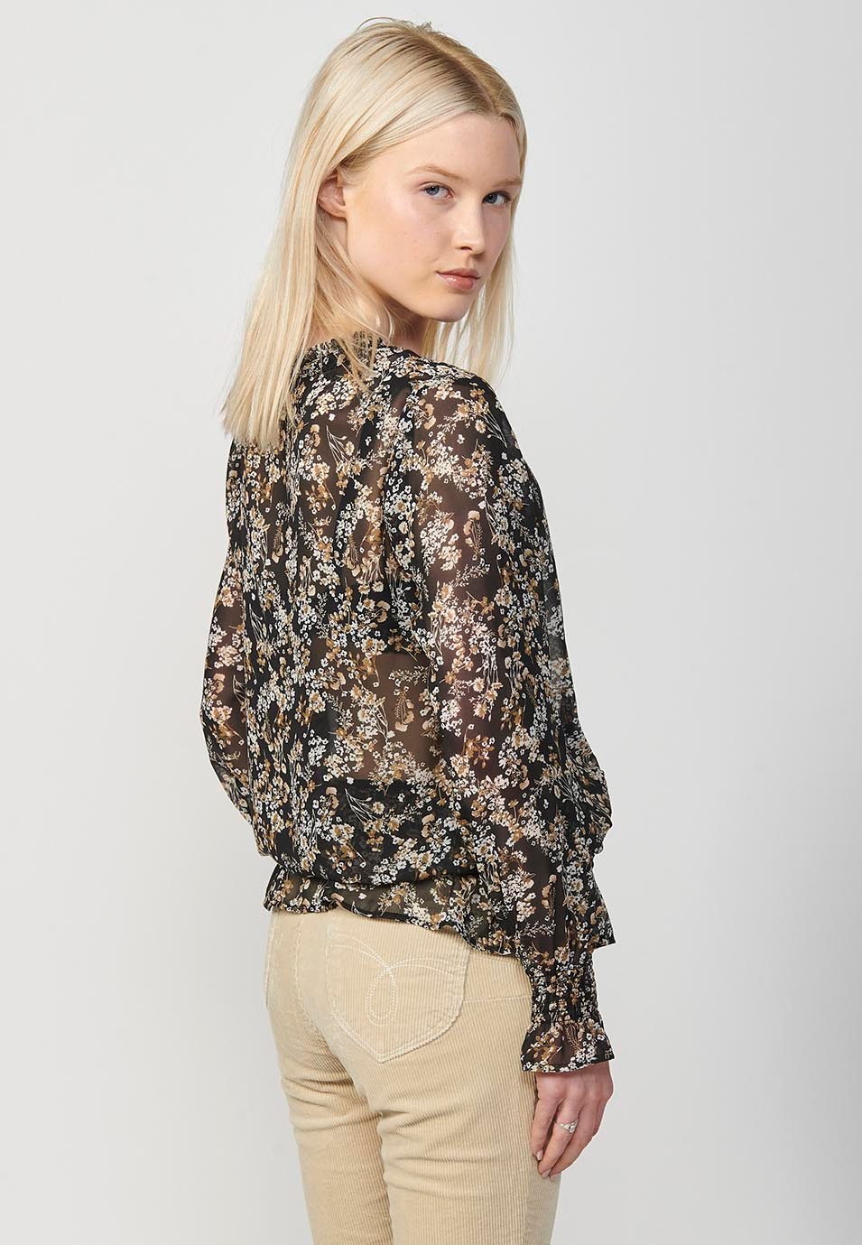 Blouse noire en mousseline à manches longues, encolure en V, bas caoutchoutés et imprimé fleuri pour Femme