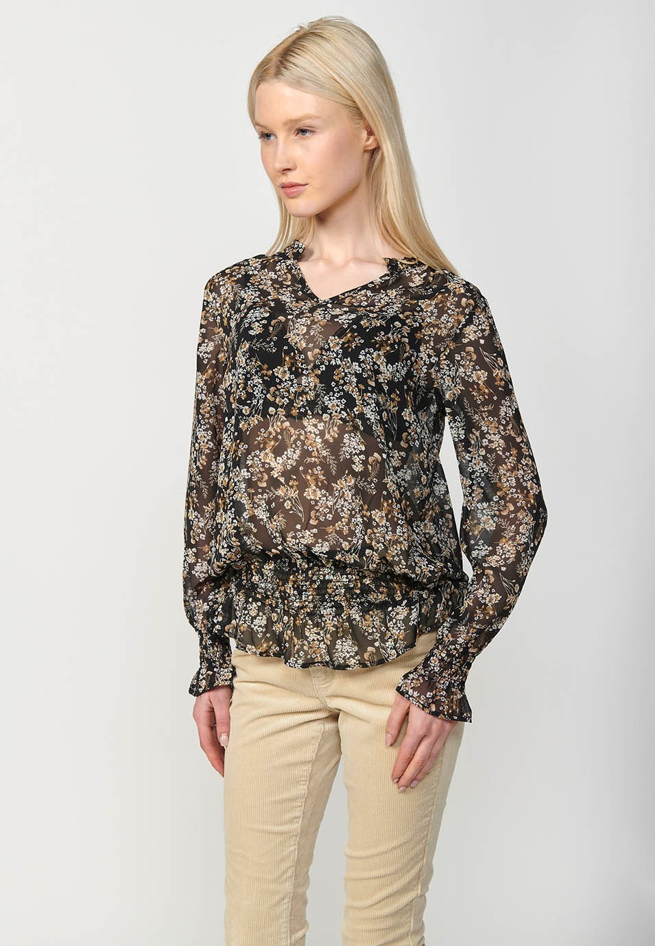 Blouse noire en mousseline à manches longues, encolure en V, bas caoutchoutés et imprimé fleuri pour Femme