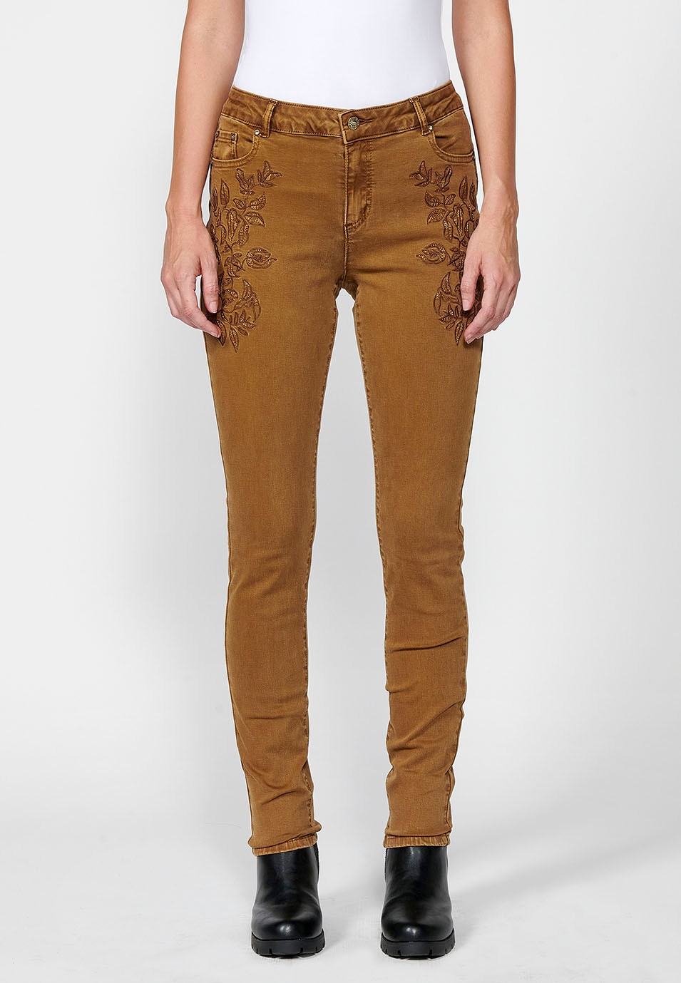 Slim fit long trousers with embroidered details and front zip and button closure for women in ochre 5