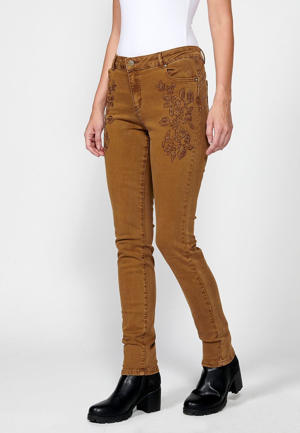 Slim fit long trousers with embroidered details and front zip and button closure for women in ochre 2