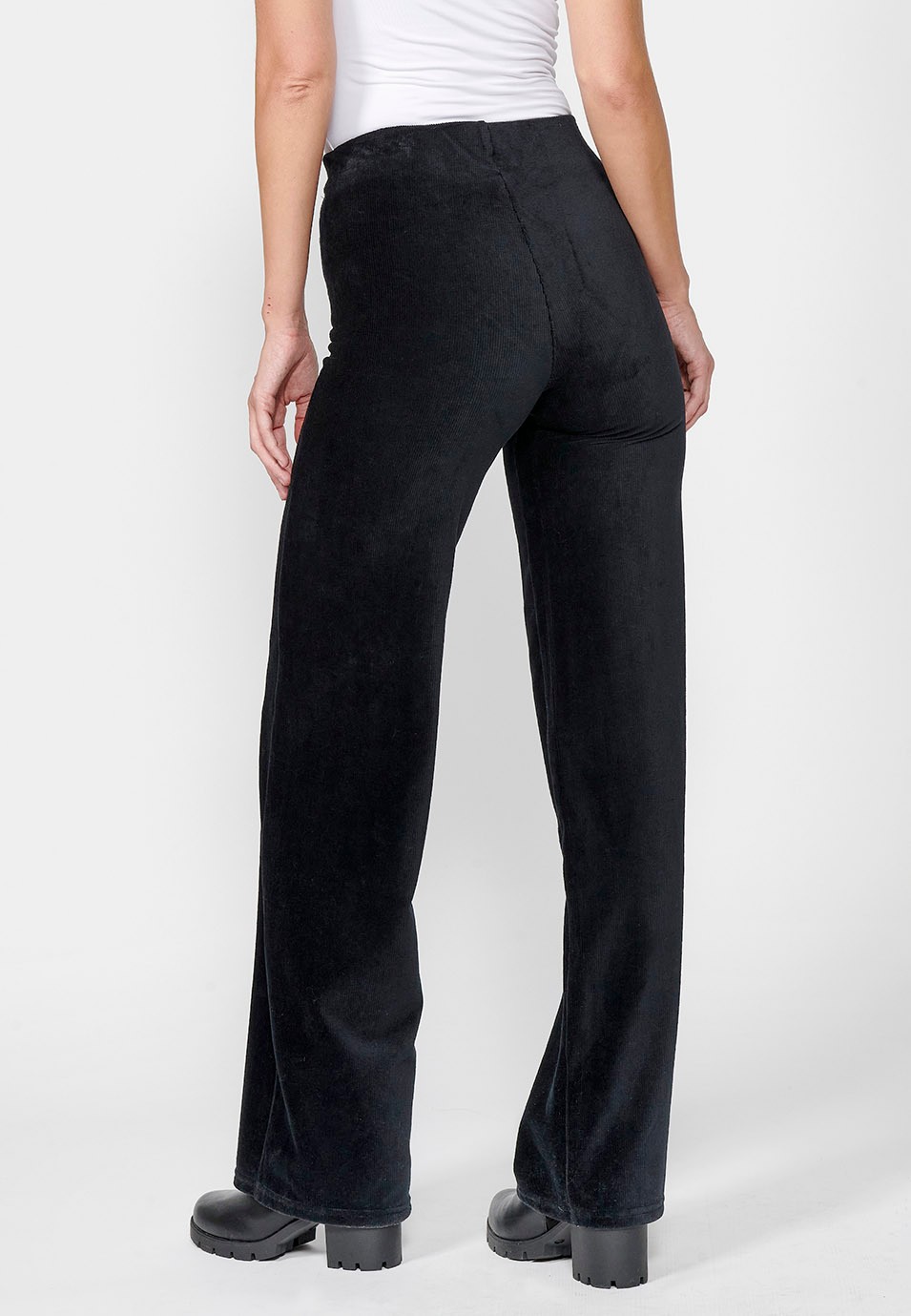 Pantalon large évasé avec taille haute caoutchoutée et tissu en velours texturé pour femme en noir