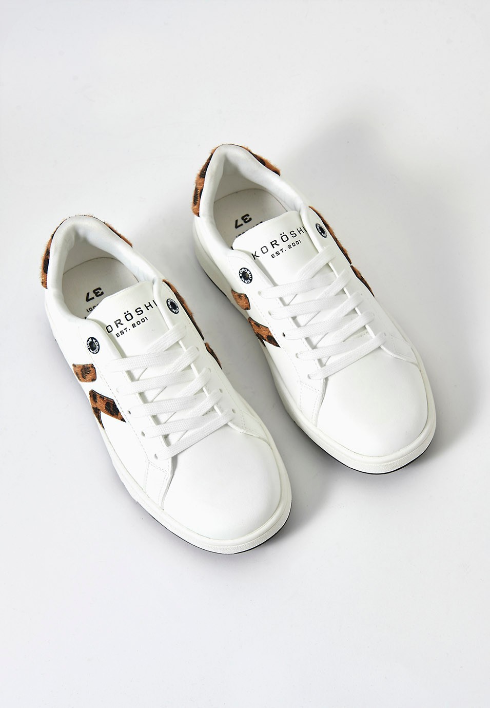 White leather effect trainers with laces and animal print details 1