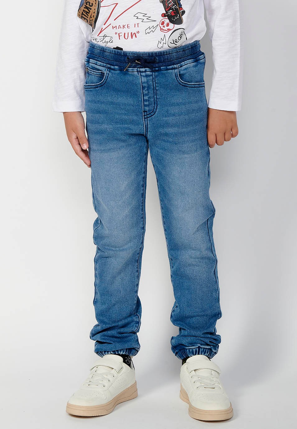 Boys' wide ribbed long trousers with elasticated waistband in blue