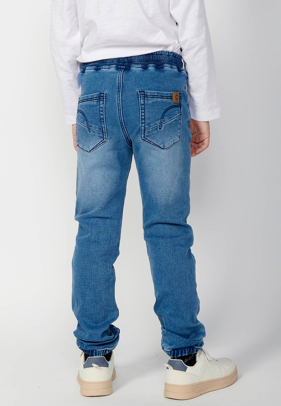 Boys' wide ribbed long trousers with elasticated waistband in blue