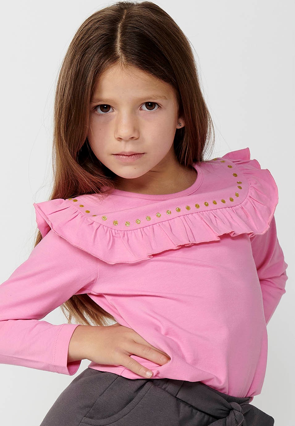 Camiseta de manga larga con detalle de volante para niña de color rosa