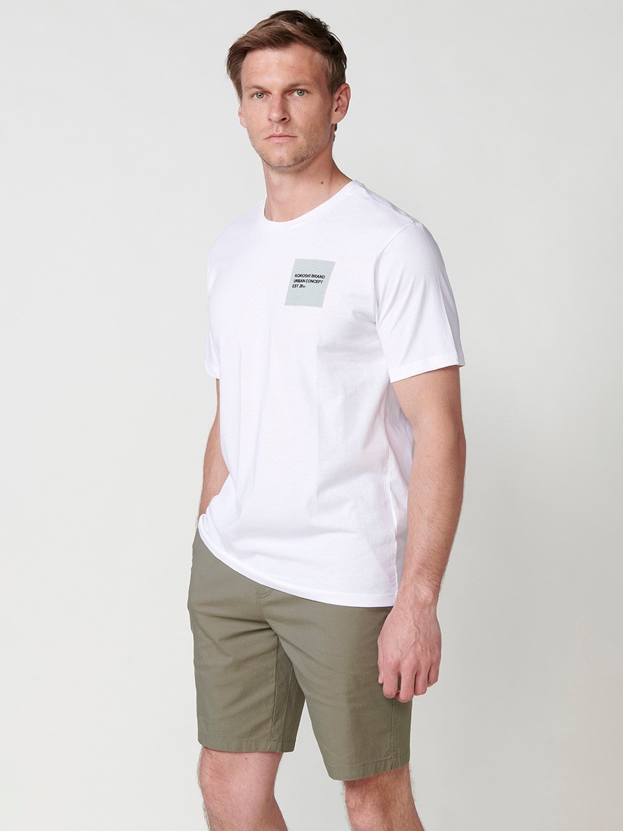 T-shirt blanc à manches courtes pour homme avec imprimé sur la poitrine