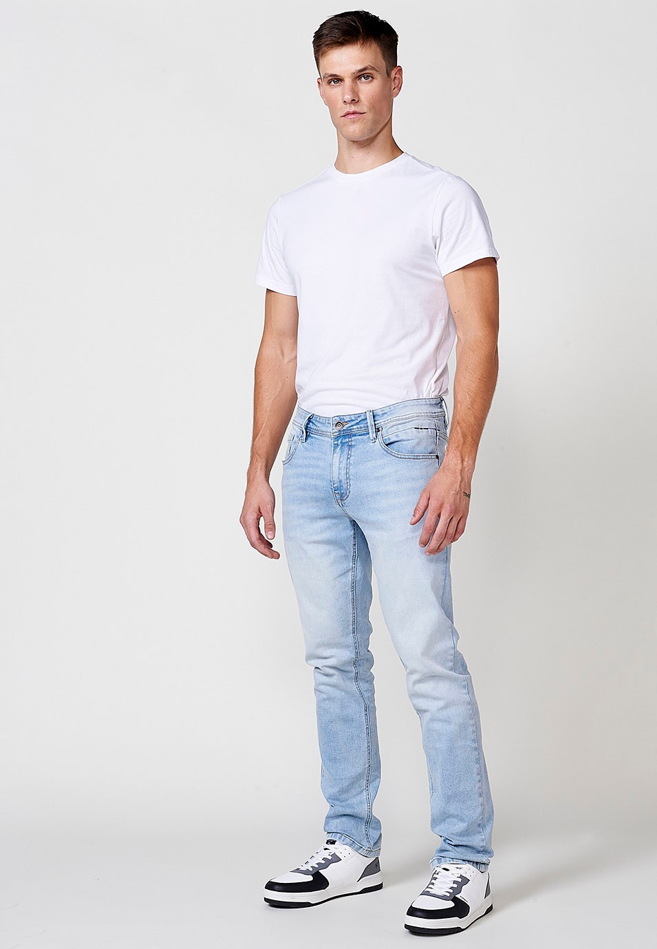 Pantalón largo denim super skinny con Cinco bolsillos, uno cerillero color Azul para Hombre