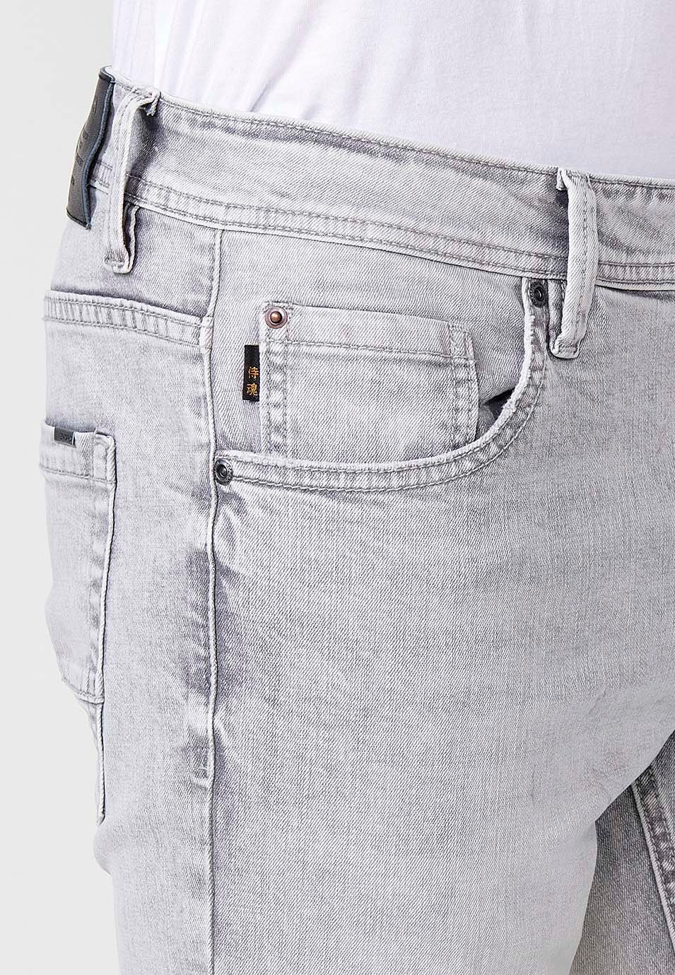 Pantalón largo denim super skinny con Cinco bolsillos, uno cerillero color Denim Gris para Hombre