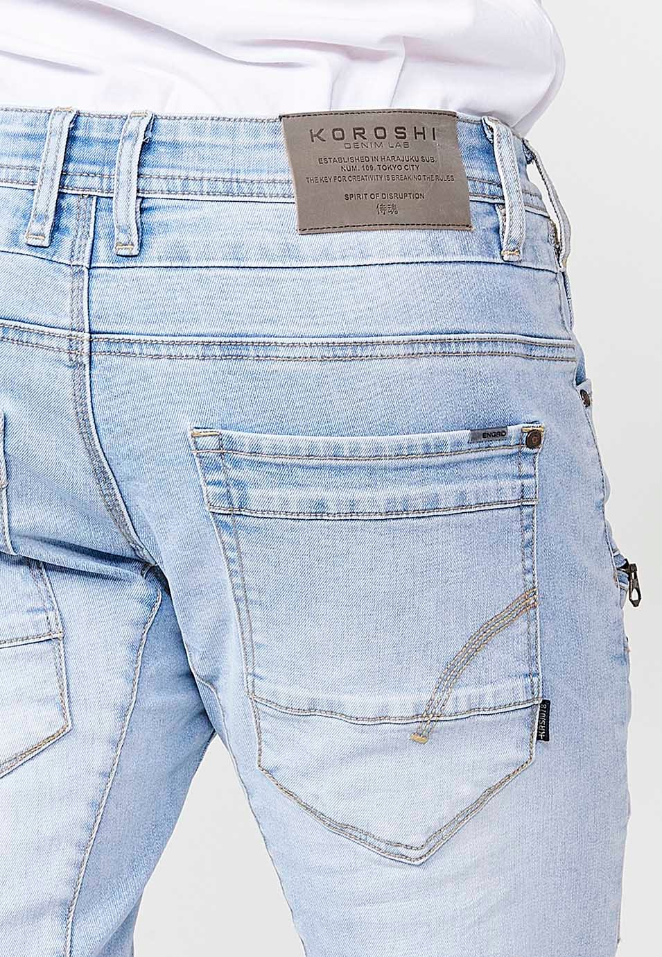 Pantalon de travail long en denim coupe classique avec cinq poches, une poche avec bouton et découpes aux genoux en Bleu pour Homme