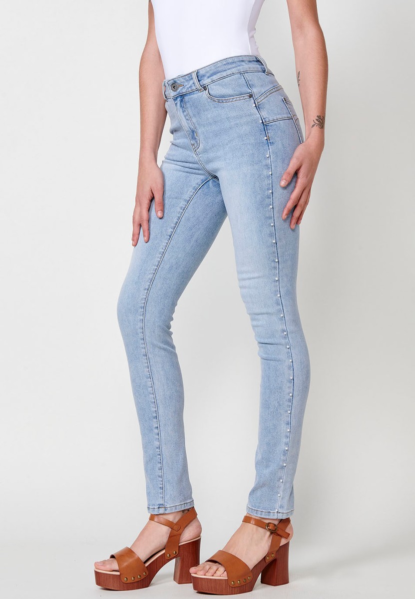 Slim fit jeans with pearl details on the sides in blue for women 5