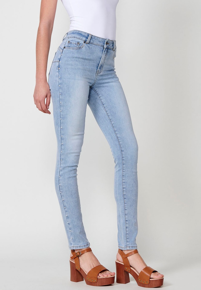 Slim fit jeans with pearl details on the sides in blue for women 8