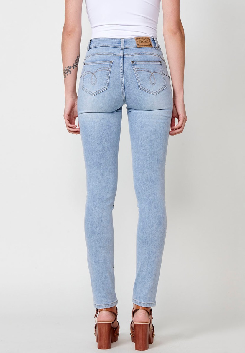 Slim fit jeans with pearl details on the sides in blue for women 3