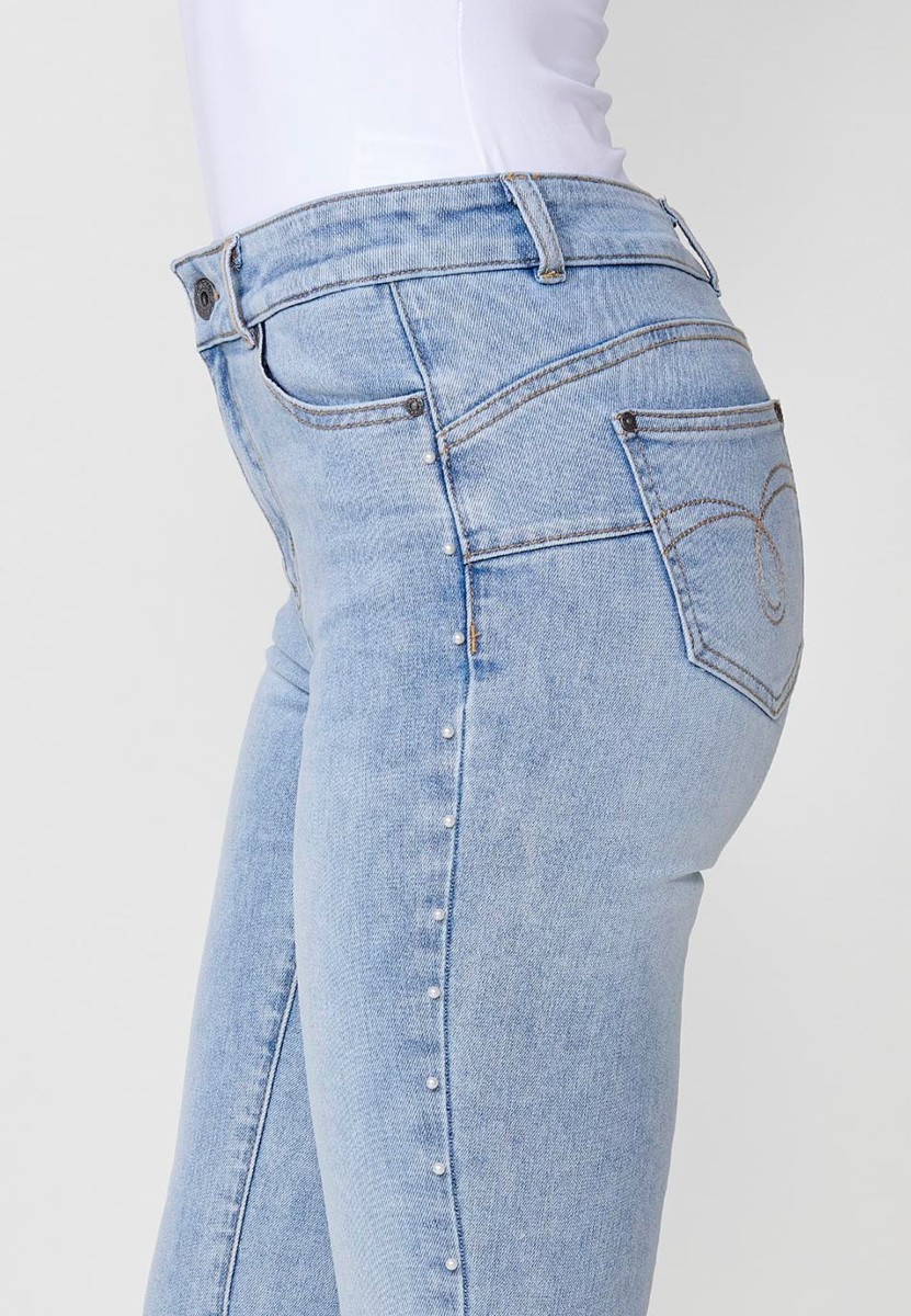 Slim fit jeans with pearl details on the sides in blue for women 7