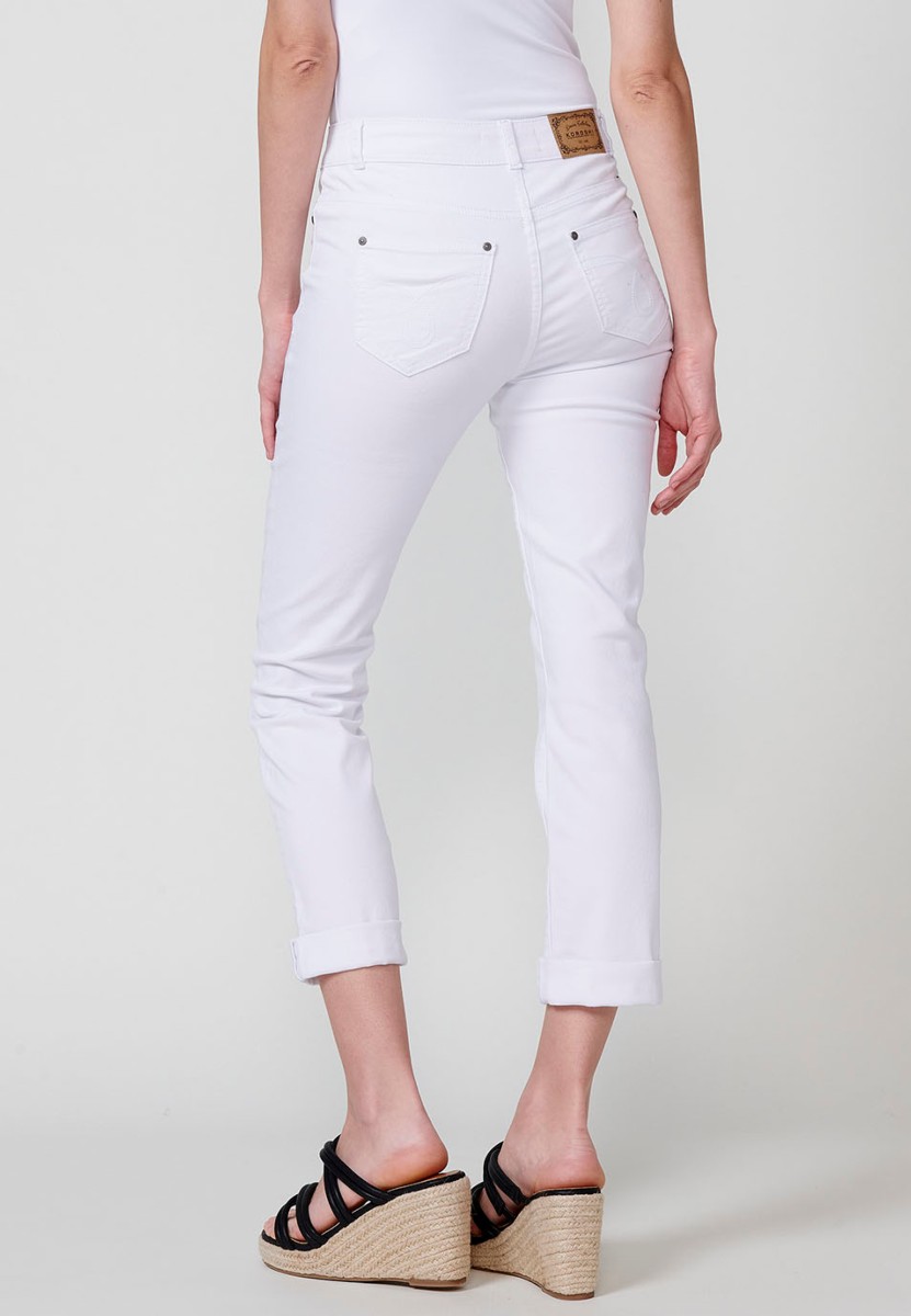 Pantalón largo acabado en vuelta, Jeans slim con Detalles bordados y brillos en los bolsillos delanteros color Blanco para Mujer