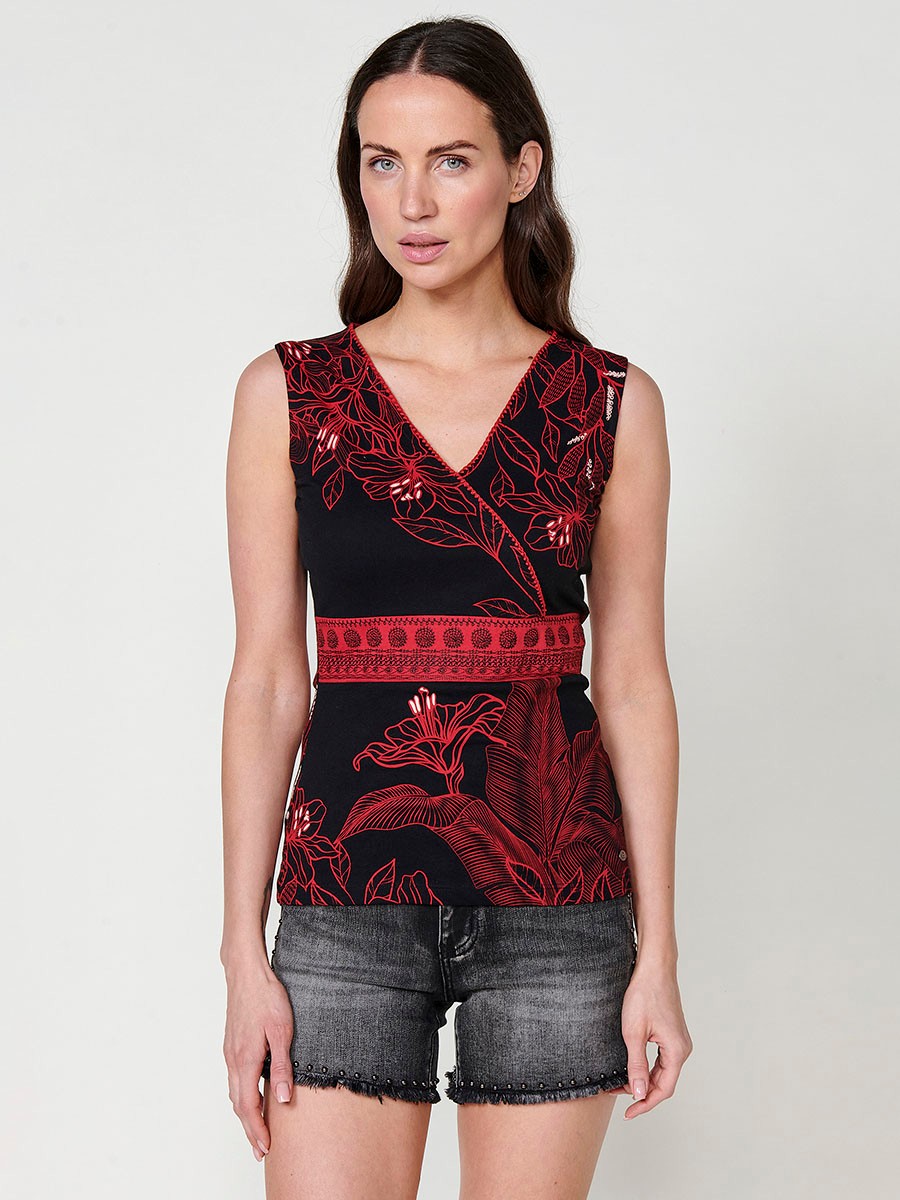 Women's wrap-neck top with embroidered detail on the side with floral print and contrasting piece on the front with embroidered detail and metal plate with Koröshi logo in ecru