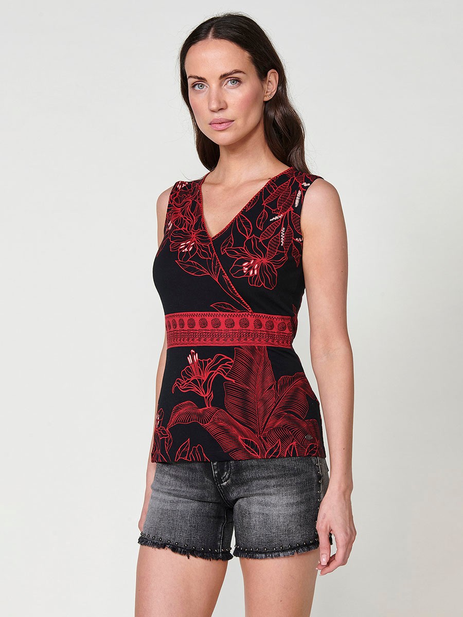 Women's wrap-neck top with embroidered detail on the side with floral print and contrasting piece on the front with embroidered detail and metal plate with Koröshi logo in ecru